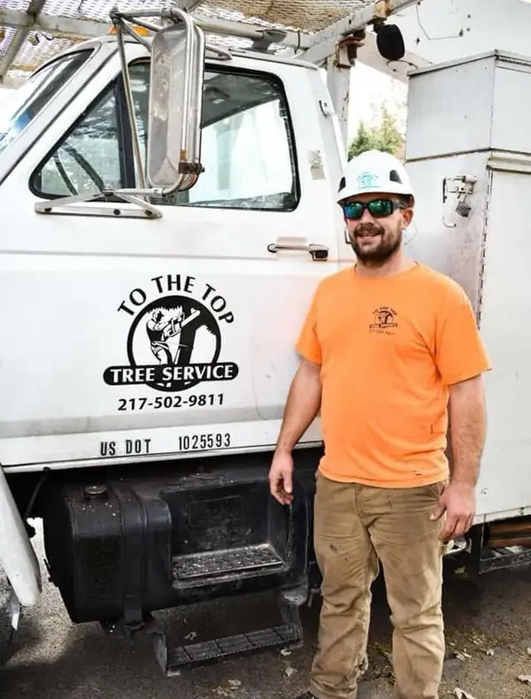 To The Top Tree Service - professional posing by company vehicle - Springfield, IL